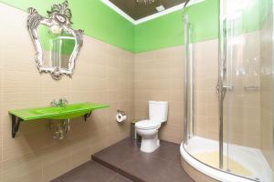 a bathroom with a sink and a toilet and a shower at Guet House Vila tejo in Vila Franca de Xira