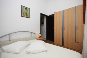 Posteľ alebo postele v izbe v ubytovaní Apartments Stipe
