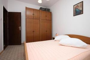 Posteľ alebo postele v izbe v ubytovaní Apartments Stipe