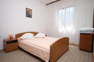 Posteľ alebo postele v izbe v ubytovaní Apartments Stipe