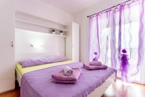 Posteľ alebo postele v izbe v ubytovaní Apartments Nada