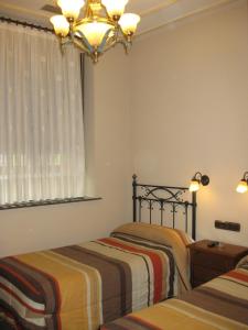 Voodi või voodid majutusasutuse Hostal Granada toas +37 fotot