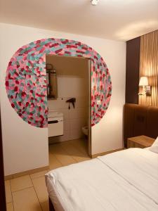 a room with a mirror with a bunch of hearts at Nani City Hotel in Zürich