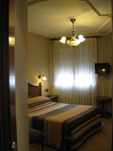 Voodi või voodid majutusasutuse Hostal Granada toas