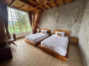 Ένα ή περισσότερα κρεβάτια σε δωμάτιο στο Batur panorama cabins +7 φωτογραφίες