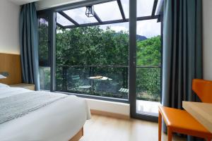 เตียงในห้องที่ 安吉季意民宿 Jiyi Boutique Homestay, Anji, Huzhou
