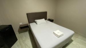 Postel nebo postele na pokoji v ubytování Hostal Bellagio + 17 fotografií