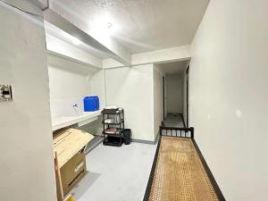 an empty room with a hallway with a sink and a floor at Home stay near at Vluna Medical Center Kalayaan Avenue, Philippine Heart Center, East Avenue Medical Hospital, Quezon City in Manila +9 photos