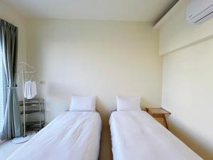 Postel nebo postele na pokoji v ubytování 日子有光 SHINE Inn Day