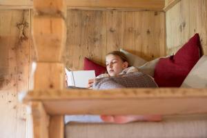 A bed or beds in a room at Chalet Hafling Leckplått