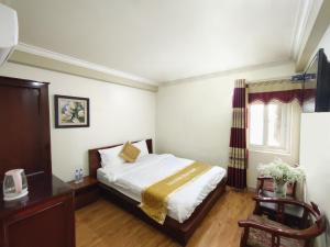 Postel nebo postele na pokoji v ubytování Indochina Airport Hotel Ha Noi