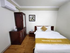 Postel nebo postele na pokoji v ubytování Indochina Airport Hotel Ha Noi
