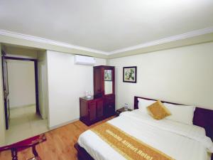 Postel nebo postele na pokoji v ubytování Indochina Airport Hotel Ha Noi
