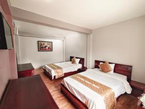 Postel nebo postele na pokoji v ubytování Indochina Airport Hotel Ha Noi