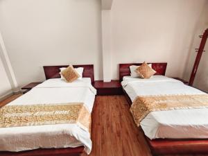 Postel nebo postele na pokoji v ubytování Indochina Airport Hotel Ha Noi