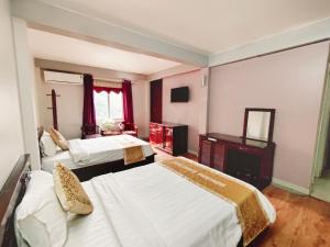Postel nebo postele na pokoji v ubytování Indochina Airport Hotel Ha Noi