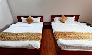 Postel nebo postele na pokoji v ubytování Indochina Airport Hotel Ha Noi