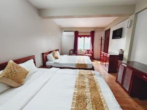 Postel nebo postele na pokoji v ubytování Indochina Airport Hotel Ha Noi