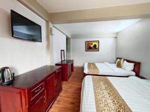 Postel nebo postele na pokoji v ubytování Indochina Airport Hotel Ha Noi