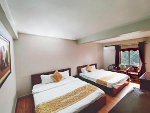 Postel nebo postele na pokoji v ubytování Indochina Airport Hotel Ha Noi
