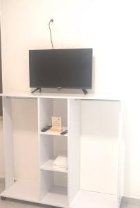 TV a/nebo společenská místnost v ubytování Venice Apartments
