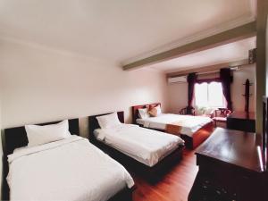 Postel nebo postele na pokoji v ubytování Indochina Airport Hotel Ha Noi