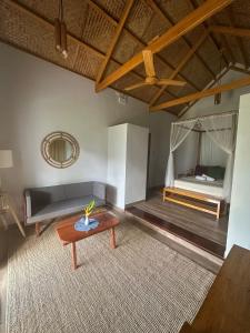 a living room with a bed and a table at ANITSA RESORT in El Nido +45 photos