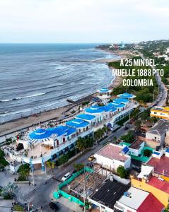 an aerial view of a beach with blue umbrellas at Moderno apto low cost 15 min CC buena vista 2 TV con parqueadero comunal in Barranquilla