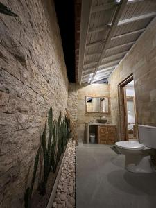 a bathroom with a sink and a toilet in a room at Nature View Inn Private House in Nusa Penida +21 photos