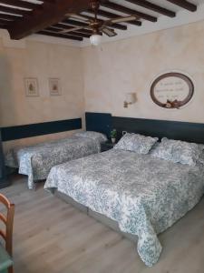 Postel nebo postele na pokoji v ubytování Hotel Borgo Antico