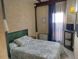 Postel nebo postele na pokoji v ubytování Hotel Borgo Antico + 37 fotografií