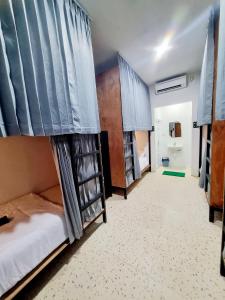 Ένα ή περισσότερα κρεβάτια σε δωμάτιο στο Jancoox Hostel