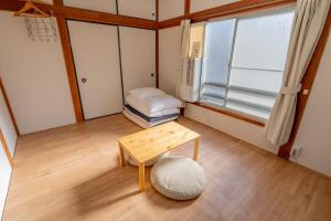 Ένα ή περισσότερα κρεβάτια σε δωμάτιο στο Kawamura Apartment 202