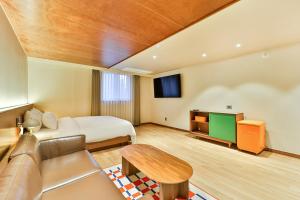 Ένα ή περισσότερα κρεβάτια σε δωμάτιο στο Gyeongju Coolstay hotel