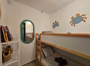 a bedroom with a bunk bed and a mirror at Urban loft Valencia playa in Puebla de Farnals +62 photos