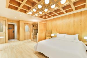 Ένα ή περισσότερα κρεβάτια σε δωμάτιο στο Gyeongju Coolstay hotel