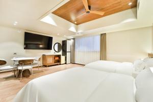 Ένα ή περισσότερα κρεβάτια σε δωμάτιο στο Gyeongju Coolstay hotel
