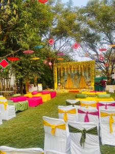 a group of tables and chairs in a field at SHLOKA RESIDENCY in Shamshabad