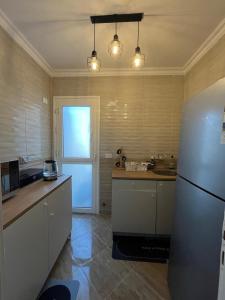 Η κουζίνα ή μικρή κουζίνα στο Elite Residence by the LOFT