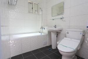 Koupelna v ubytování Guo Chen Hotel