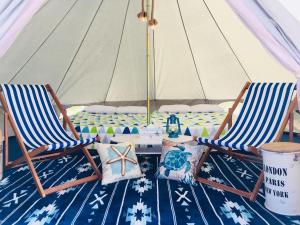 two chairs and a table in a tent at Neo Grand in Minamiboso