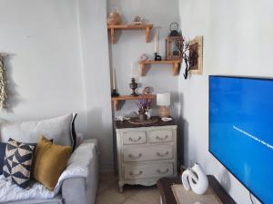 TV a/nebo společenská místnost v ubytování Maison Elix