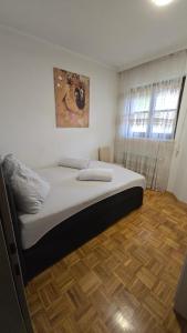 Postel nebo postele na pokoji v ubytování Apartment Dolina 8a Kärnten KLagenfurt