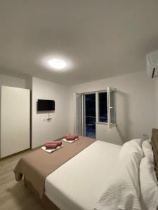 Ένα ή περισσότερα κρεβάτια σε δωμάτιο στο Apartments Belin +32 φωτογραφίες