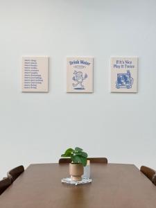 a table with a potted plant sitting on top at Ladybugg Chiang Mai in Chiang Mai +12 photos