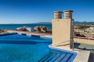 a large swimming pool on top of a building at Park Suites Family Rentalmar in Salou