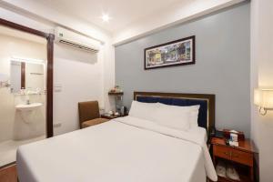 Ένα ή περισσότερα κρεβάτια σε δωμάτιο στο A25 Hotel - 30 An Dương