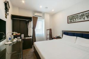 Ένα ή περισσότερα κρεβάτια σε δωμάτιο στο A25 Hotel - 30 An Dương