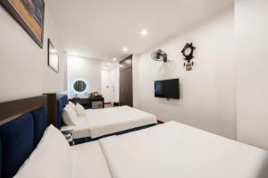 Postel nebo postele na pokoji v ubytování A25 Hotel - 30 An Dương + 22 fotografií