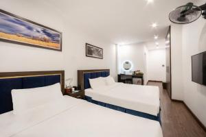 Ένα ή περισσότερα κρεβάτια σε δωμάτιο στο A25 Hotel - 30 An Dương